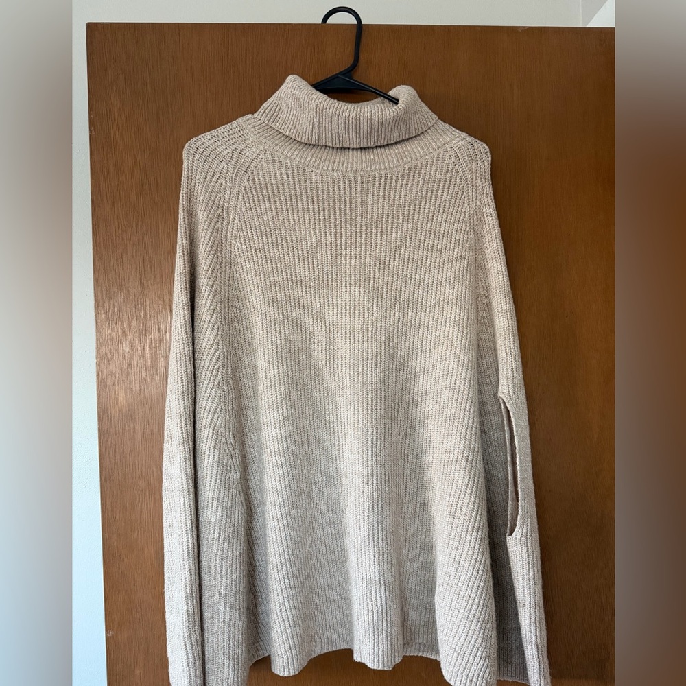 Women’s poncho sweater size small. New, never worn. Beige color, knitted.